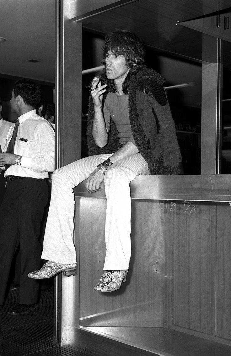 Keith Richards smoking a cigarette at the airport in the early 70s