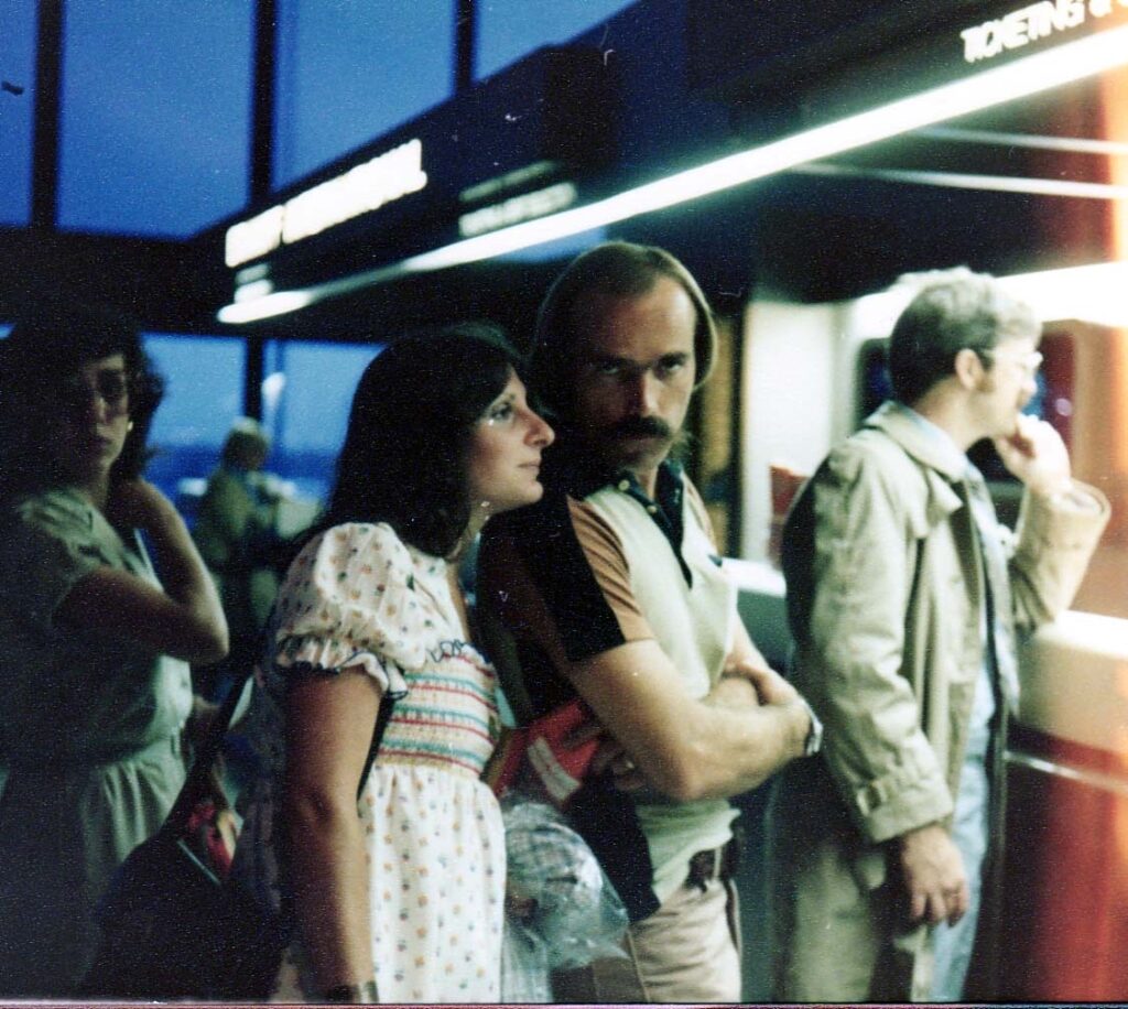 people waiting 1970s airport